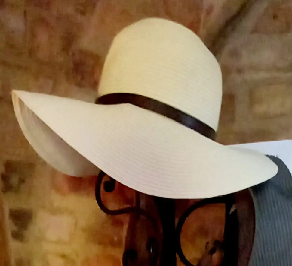 A cozy corner of the shop with soft throws and cushions.