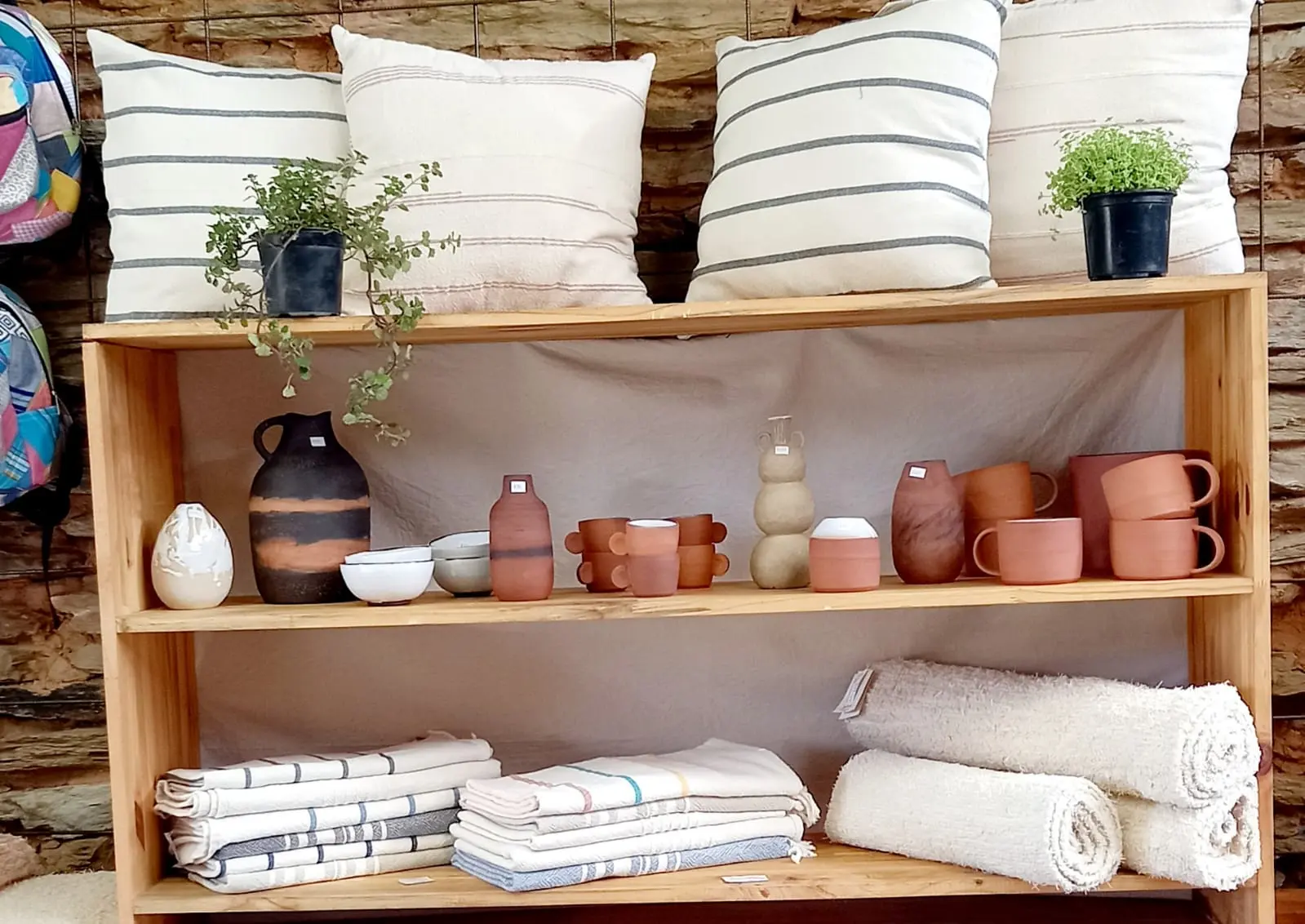 A view of the shelves inside the Nest shop, filled with various products.